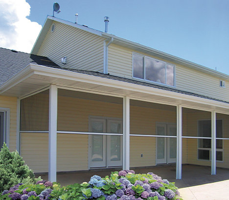 Exterior side of house displaying a retractable screen room